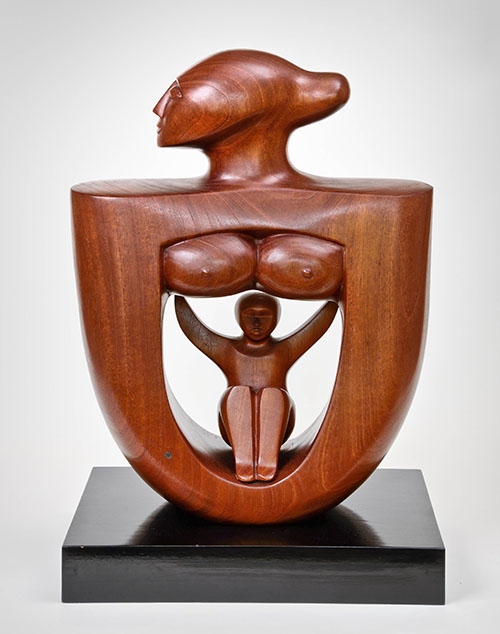 Wood sculpture of a bust of a woman with an opening in the center showing a child sitting inside